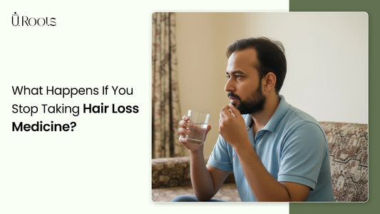 Man drinking water while thinking about stopping hair loss medication.